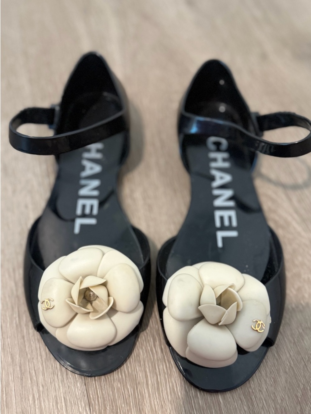 CHANEL Black Jelly Sandals with Ivory Camellia